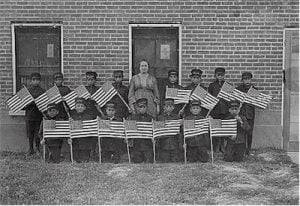 Albuquerque Indian School very early class of young boys with flags
