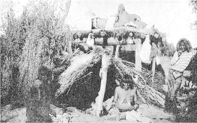 Yuma Indians and hut, showing home life
