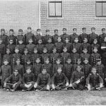 Early Albuquerque Indian School class of young men in uniform