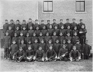 Early Albuquerque Indian School class of young men in uniform