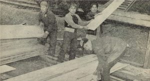 Indians unload Oregon timber at Naval Supply Depot