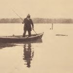 Pamunkey fisherman poling a boat to visit set-lines.